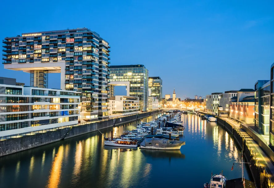 The Rheinauhafen at blue hour, the crane houses above the marina