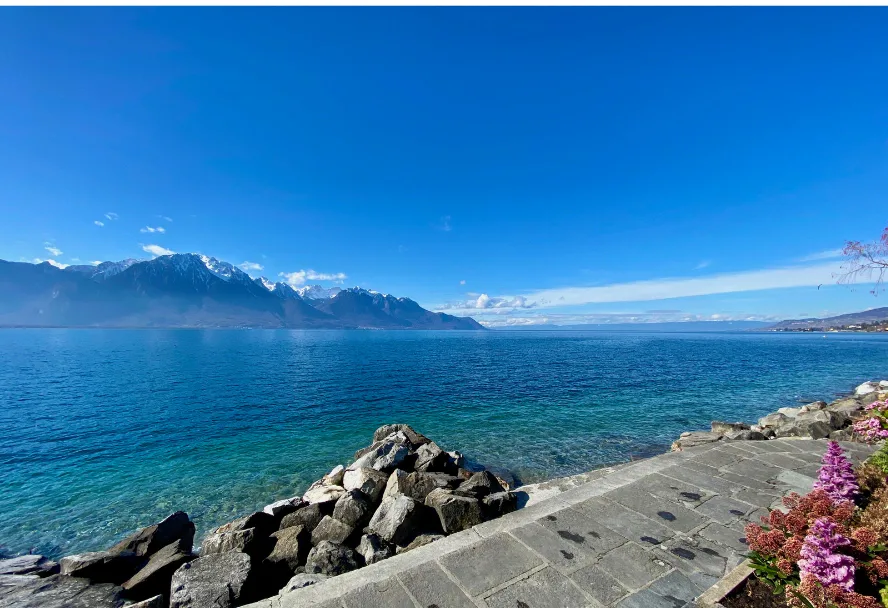 Lake Geneva with the snow-covered Savoy Alps on the opposite shore