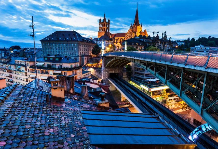 The cathedral of Lausanne above the Grand-Pont bridge in the blue hour