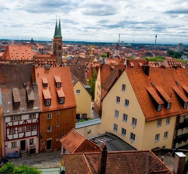 View over the red tiled roofs of the old town to the tower of the Sebalduskirche