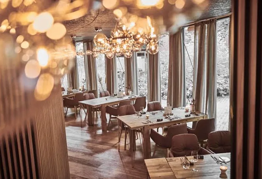 Warmly lit dining room in the evening