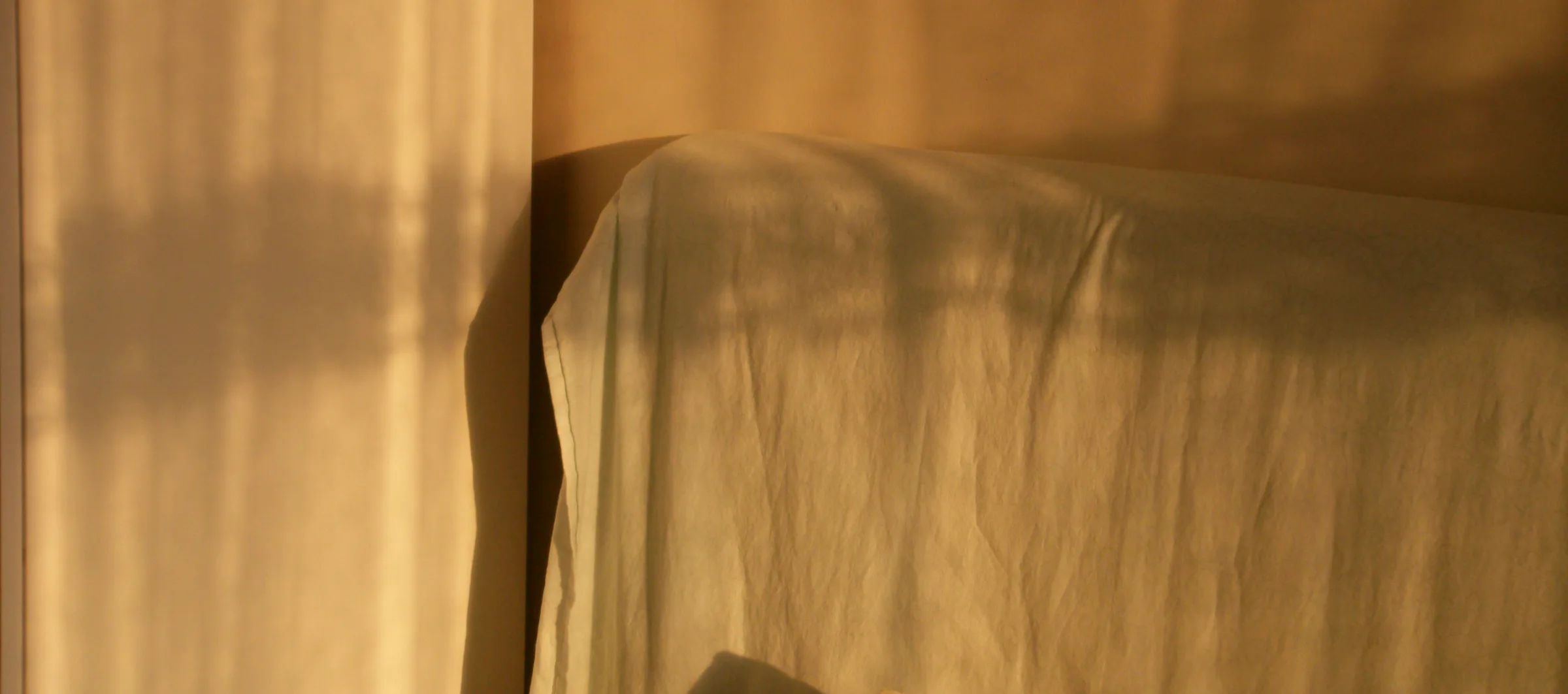 Warm light on bed linen