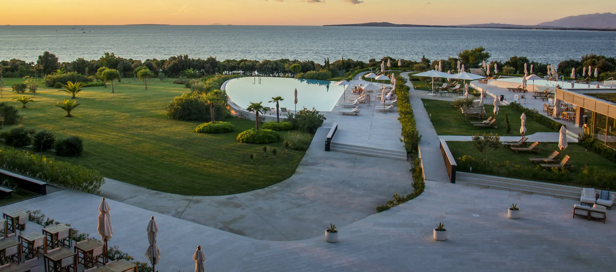 A hotel terrace above the sea at sunrise